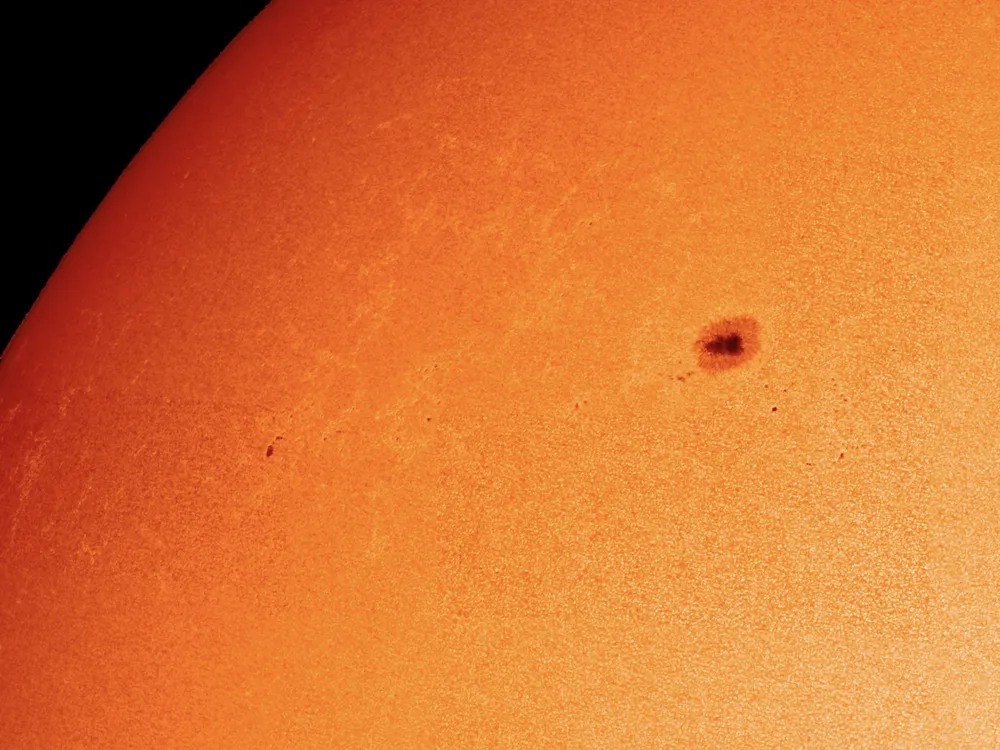 a portion of the sun in high resolution depicting a large sunspot